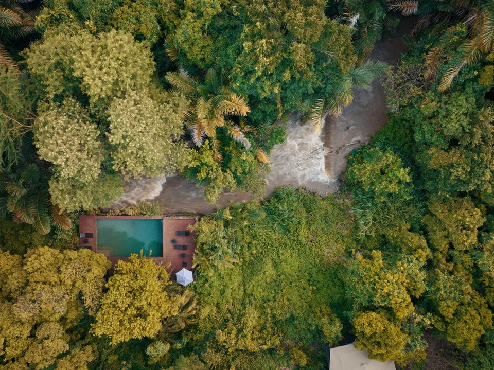 Camp pool and seasonal river setting from above