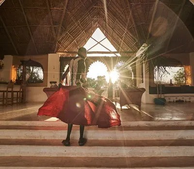 Sasaab entrance with a person in a red dress