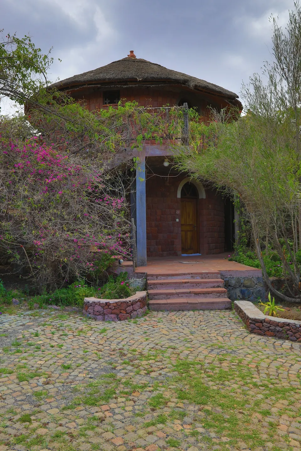 Stone tukul building and garden entrance