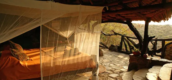 Sabuk netted bed and open-sided room