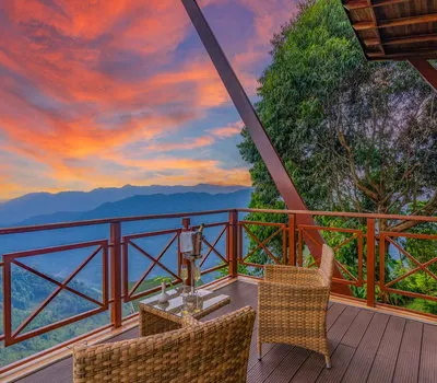 Gorilla Heights Lodge furnished balcony at sunset; inline preview
