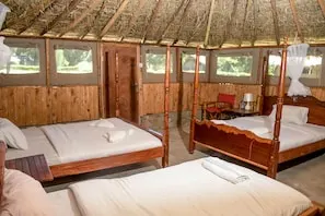 Giraffe Hills Mara Camp bedroom with several beds