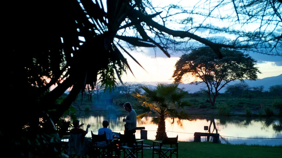 Voyager Ziwani riverside garden and seating at dusk