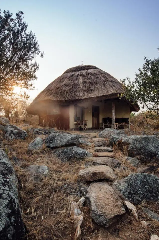 Thatched cottage exterior on the rocky outcrop
