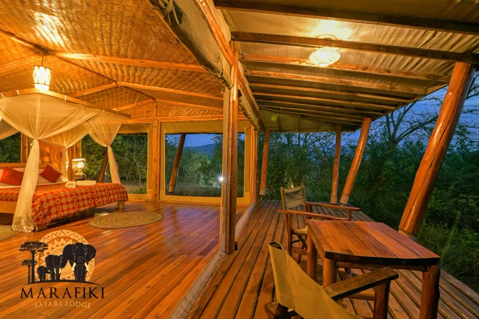Safari tent opened towards veranda at dusk