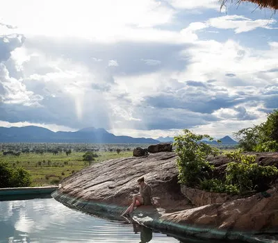 Apoka rock-edged swimming pool and savanna view; public inline preview