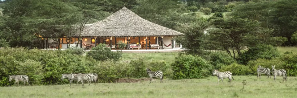 Mara Major Camp thatched communal building and gardens