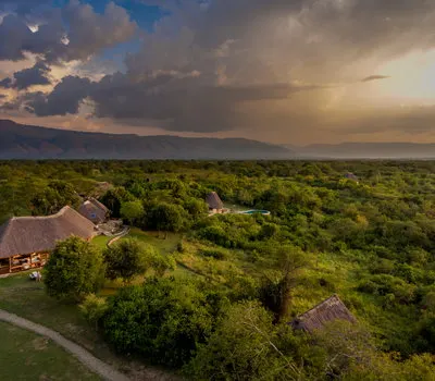 Semliki Safari Lodge buildings in forested landscape; public inline preview