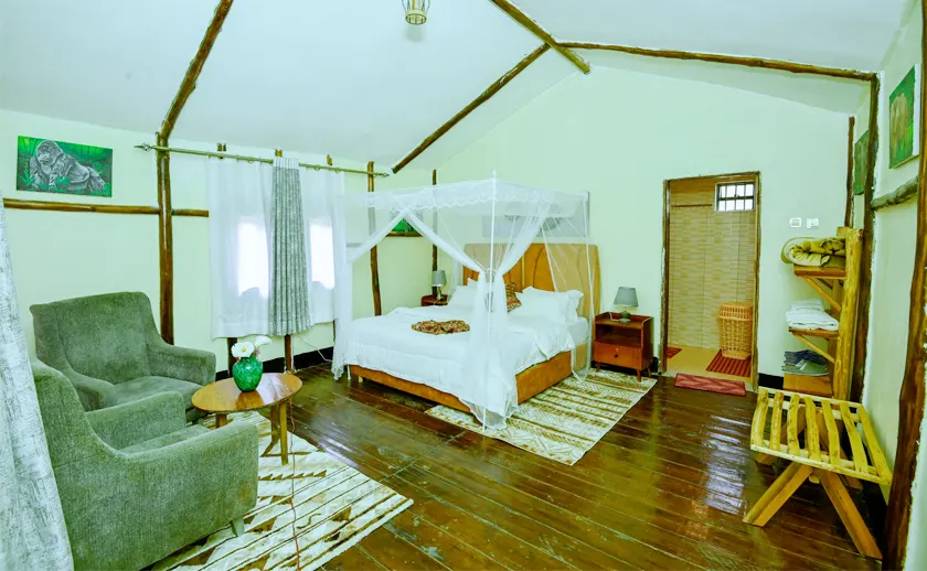 Gorilla Mist Camp double bedroom with netted bed and wooden floor