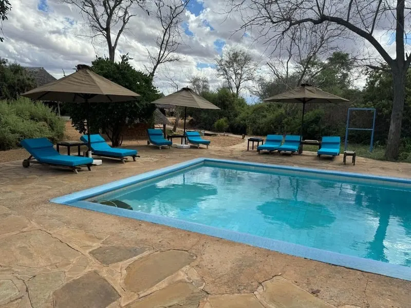 Galana Crocodile Camp pool and thatched units