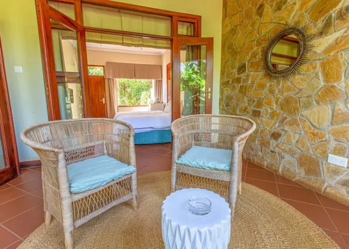 Acacia Farm Lodge sitting area opening to bedroom