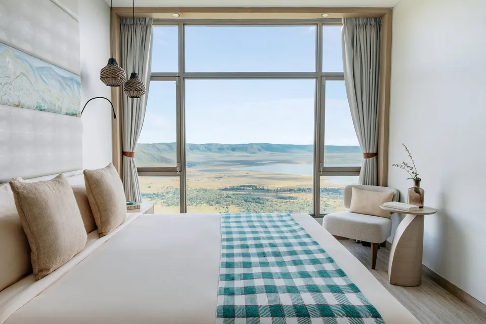 Luxury bedroom with panoramic Ngorongoro Crater view.