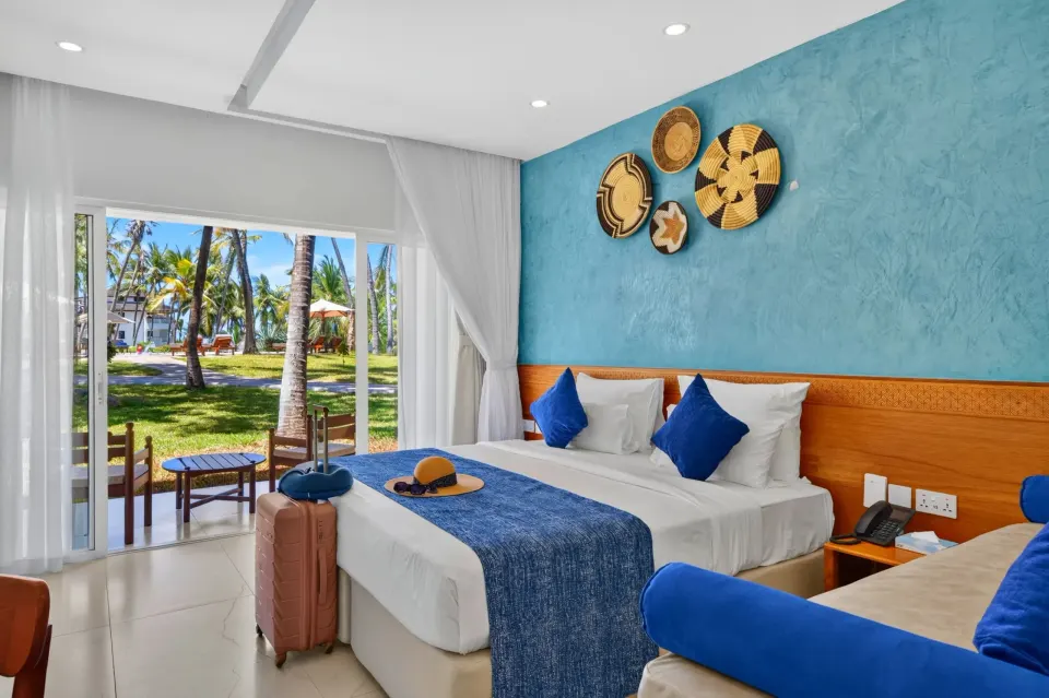 PrideInn Flamingo room and garden-facing terrace
