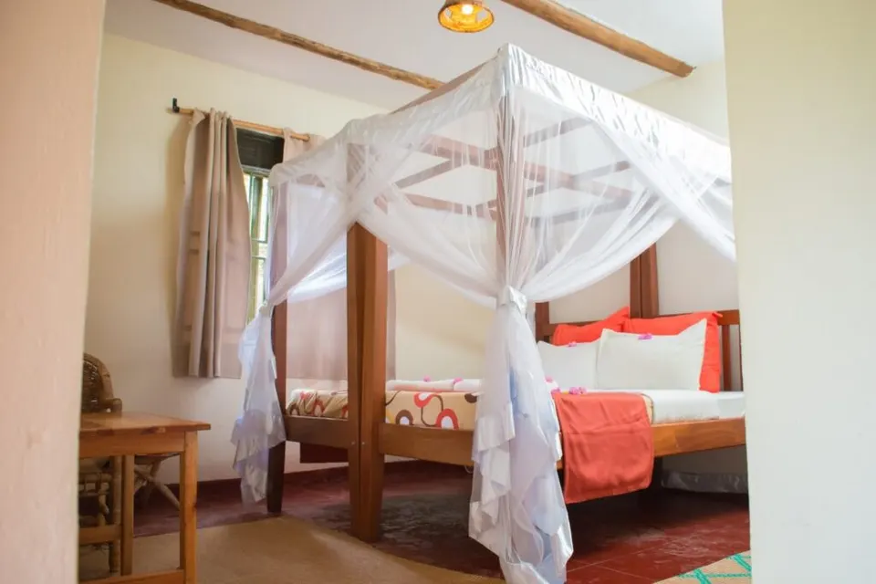 Gorilla Valley Lodge bedroom with netted bed