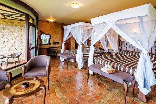 Lake Nakuru Sopa room interior with two netted beds