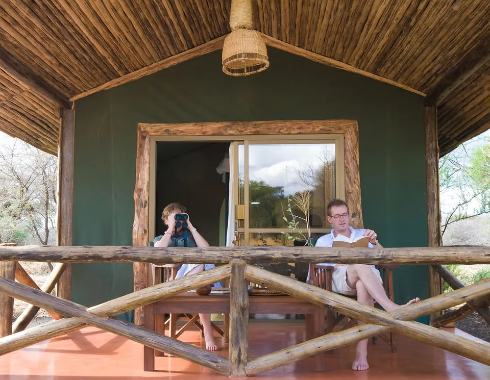 Guests seated on a cottage veranda