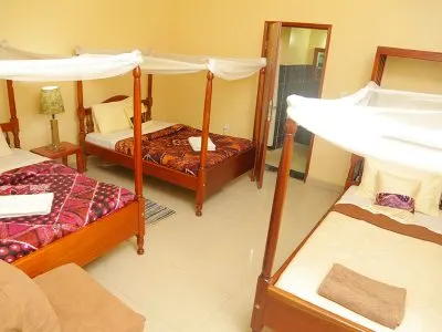 Triple-room image with three beds