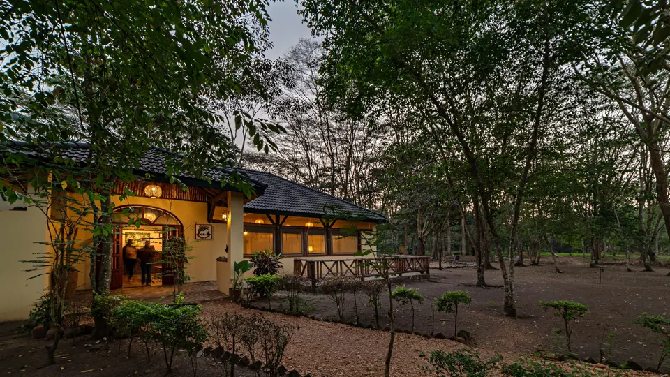 Lodge building and garden at dusk