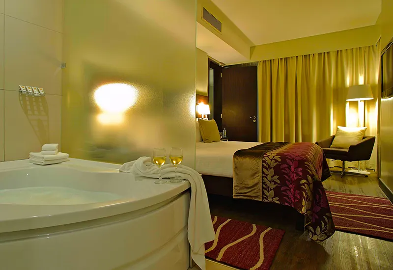Eka Executive Suite bathroom and sitting area