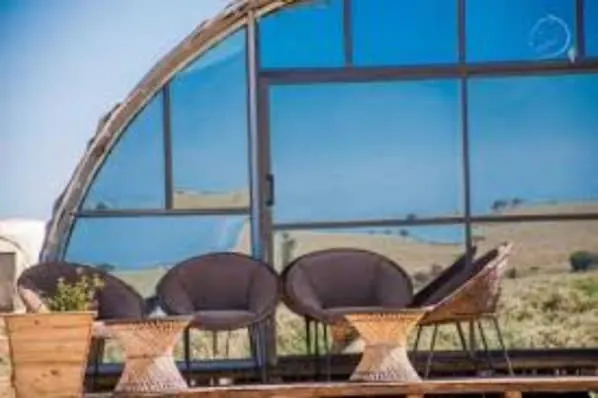 Little Amanya covered veranda beside curved tent