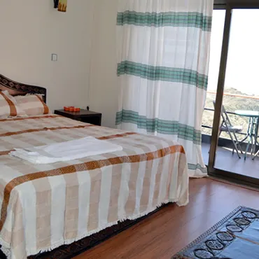 Panoramic View Hotel double bedroom and balcony doorway