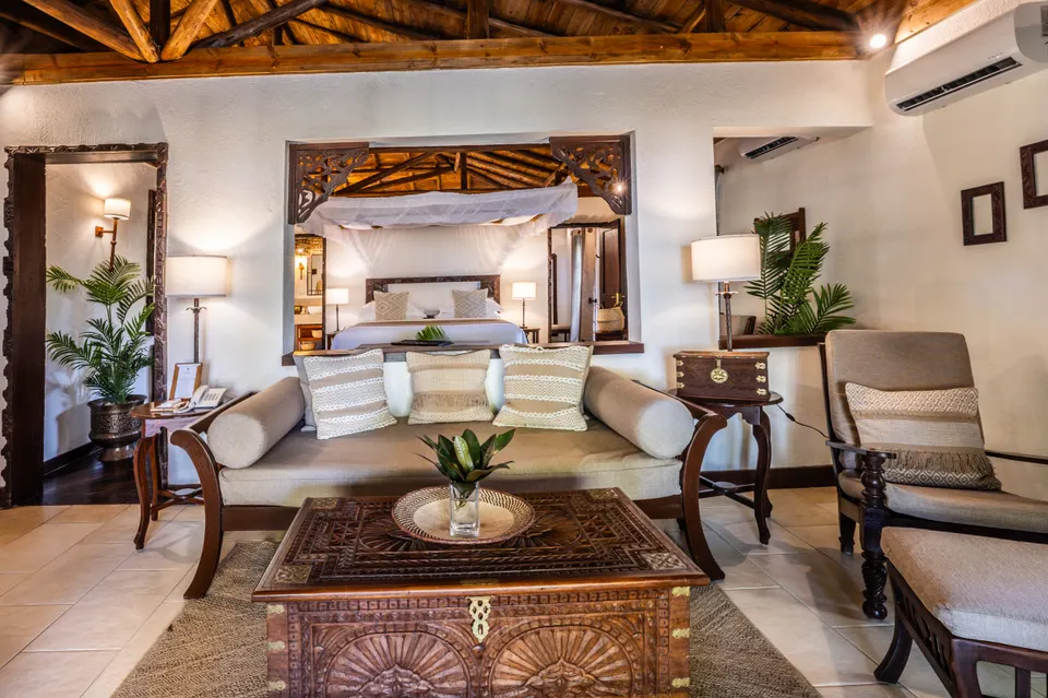Private villa living room and bedroom at The Palms