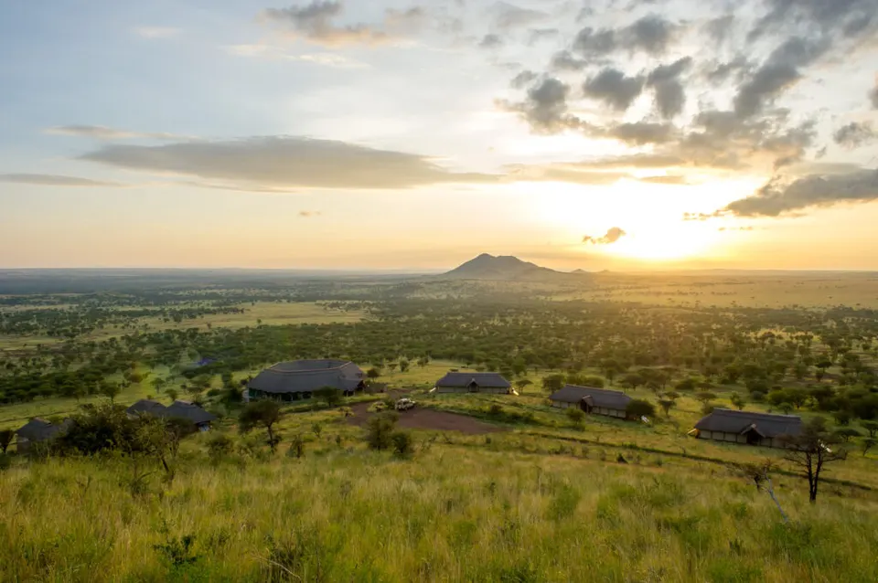 Lodge and plains at sunrise