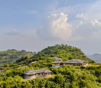 Kibale Lodge bandas on a green hillside, public operator-supplied inline preview