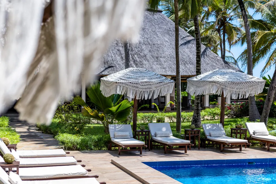 Loungers and the main pool at The Palms