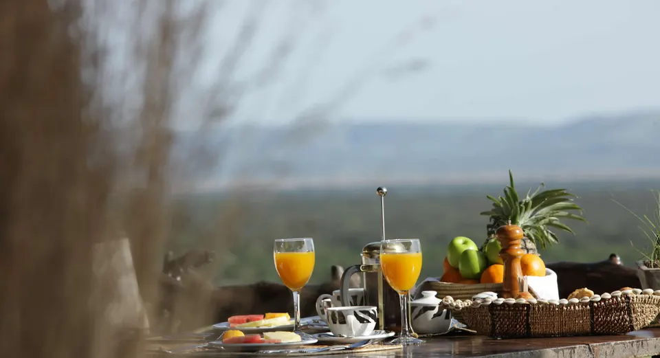 Breakfast and juice setup overlooking the surrounding landscape at Mbalageti