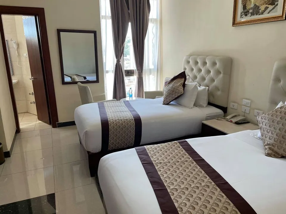 Bedroom with two visible beds