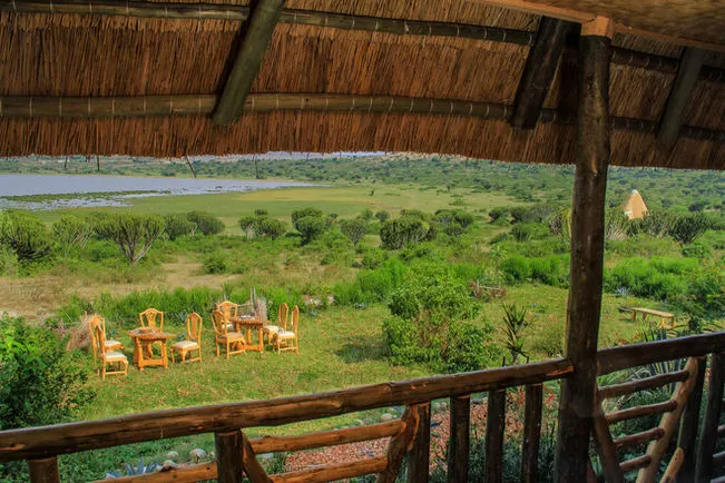 View from a thatched terrace towards the grounds