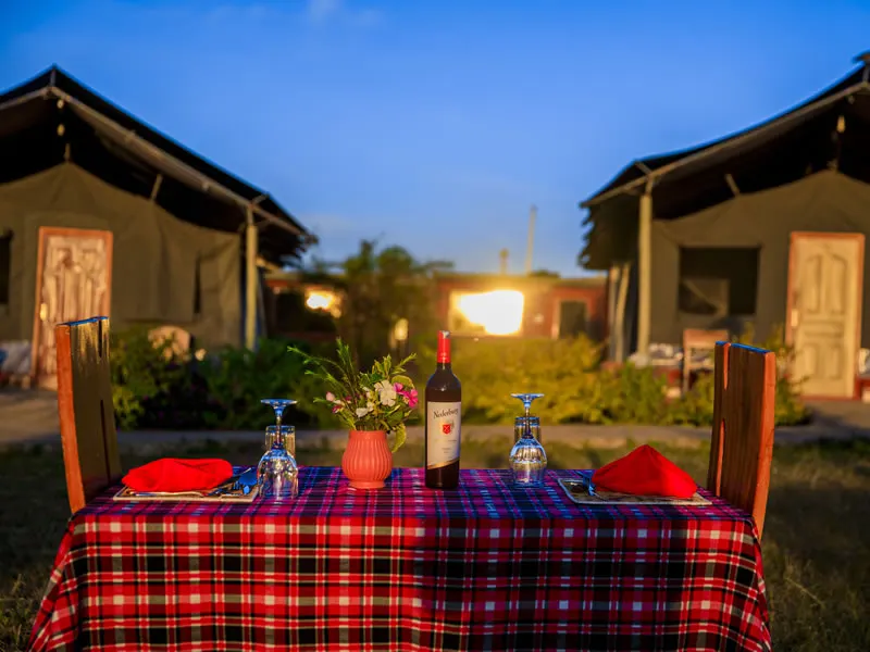 Endeem Mara dining setup beside tents