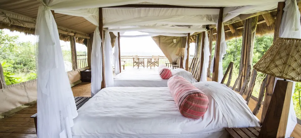 Tented bedroom opening onto its veranda