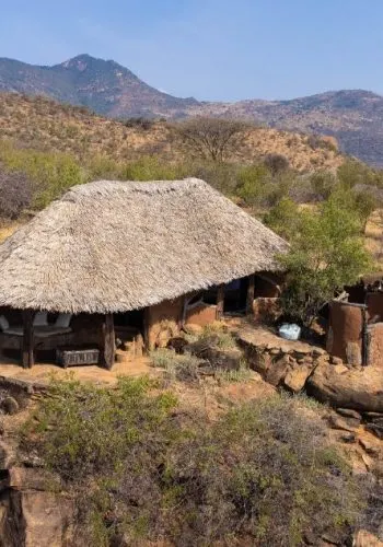 Lodge exterior and surrounding hills