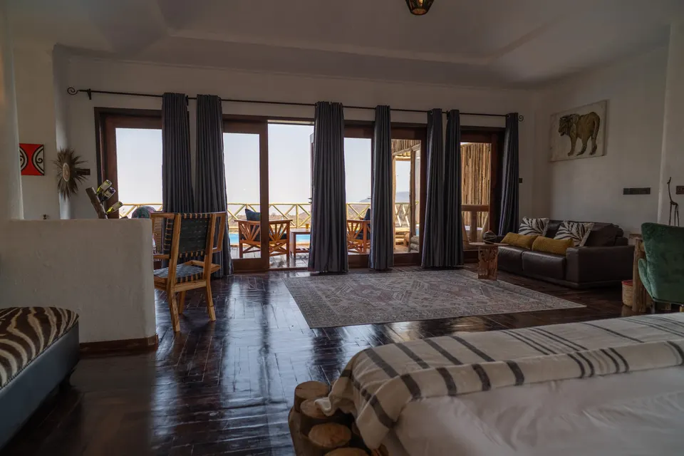 Escarpment Luxury Lodge Manyara room lounge and pool outlook