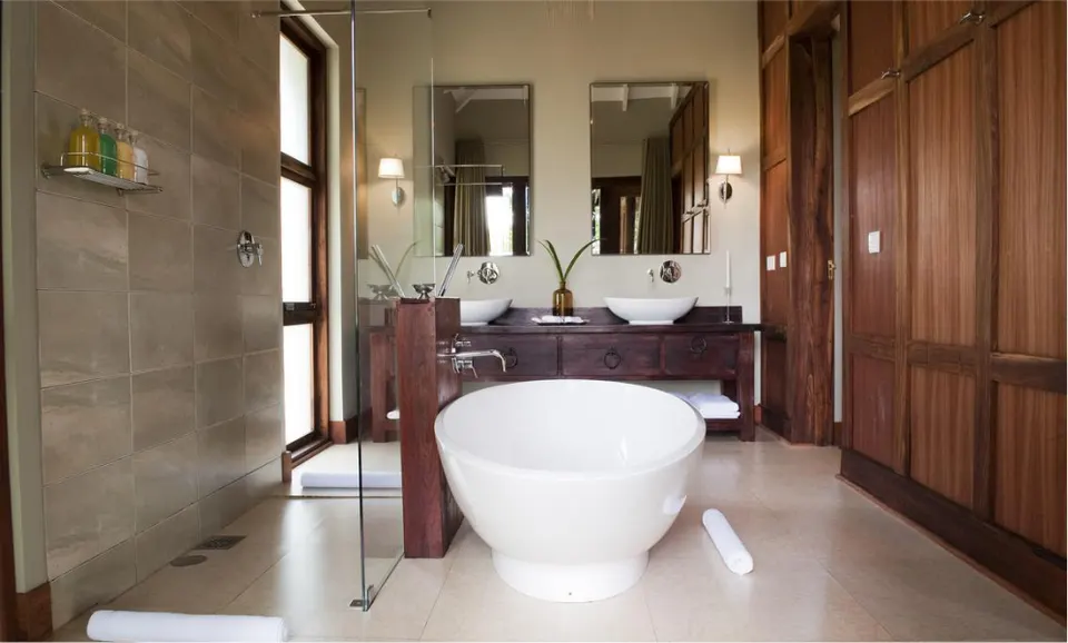 Chalet bathroom with freestanding bathtub at Lake Duluti Lodge