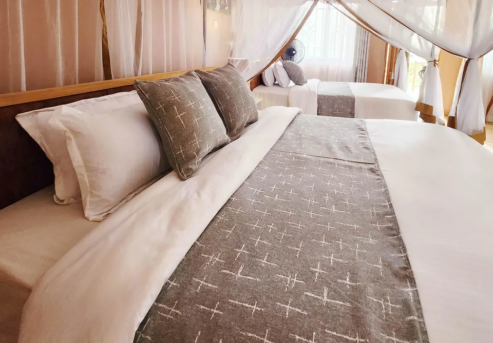 Penety Amboseli Resort bedroom with netted beds
