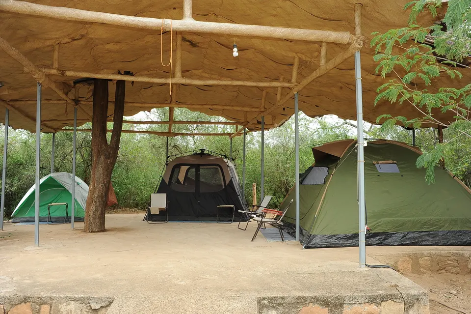 Roofed camping island with tents