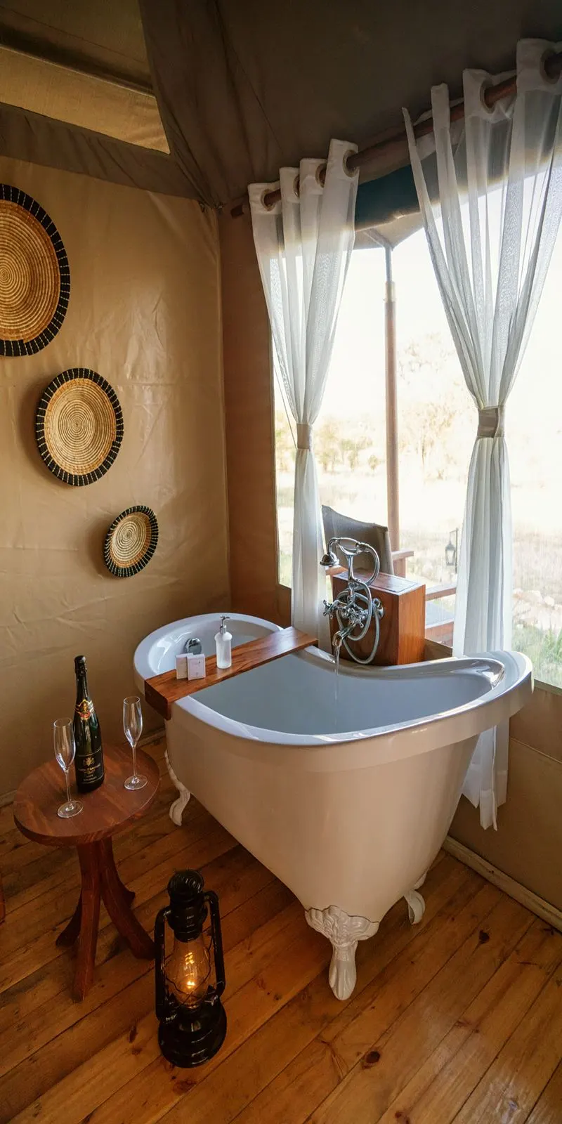 Clawfoot bath beside window