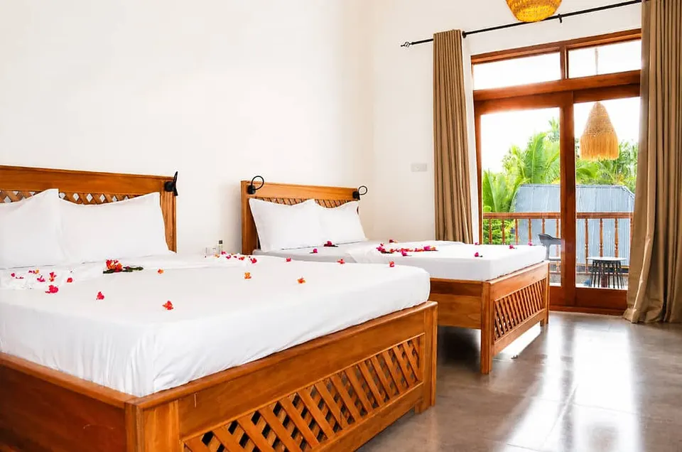 Guest room with two wooden beds