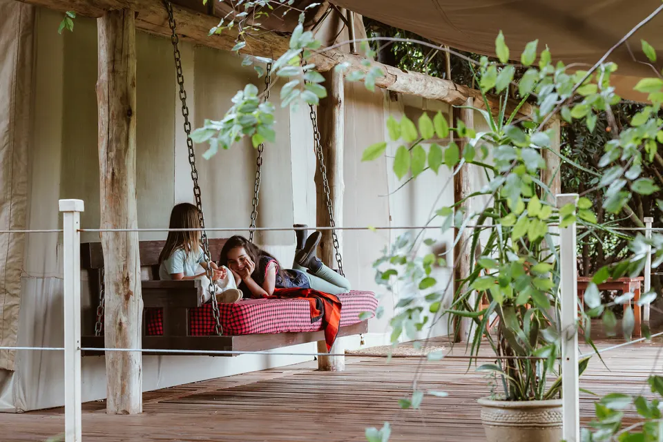 Basecamp Maasai Mara tent veranda with hanging seat