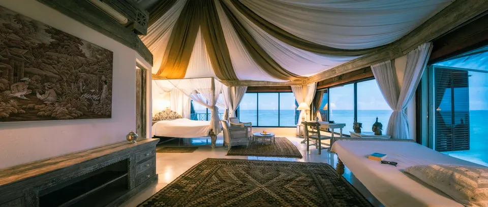 Alfajiri Cliff Villa upper bedroom with ocean-facing windows