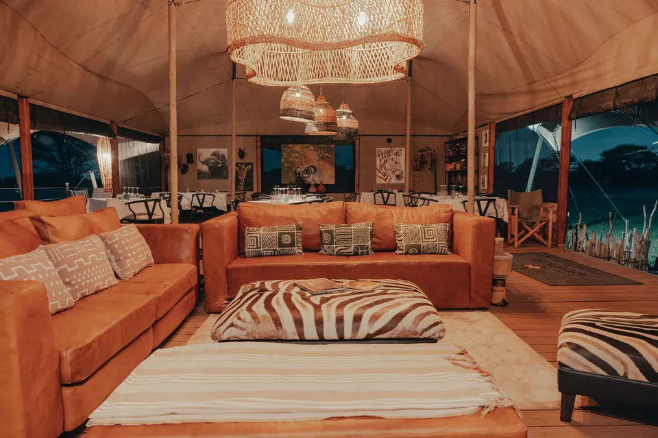 Communal lounge with sofas and zebra-patterned furnishings; image filename does not prove restaurant