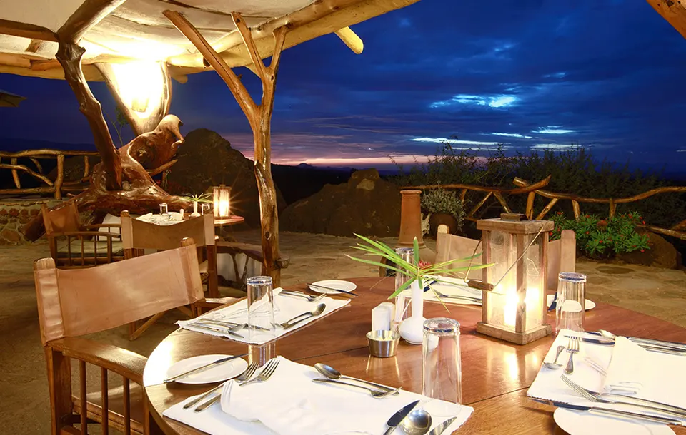 Elerai Camp terrace dining at dusk