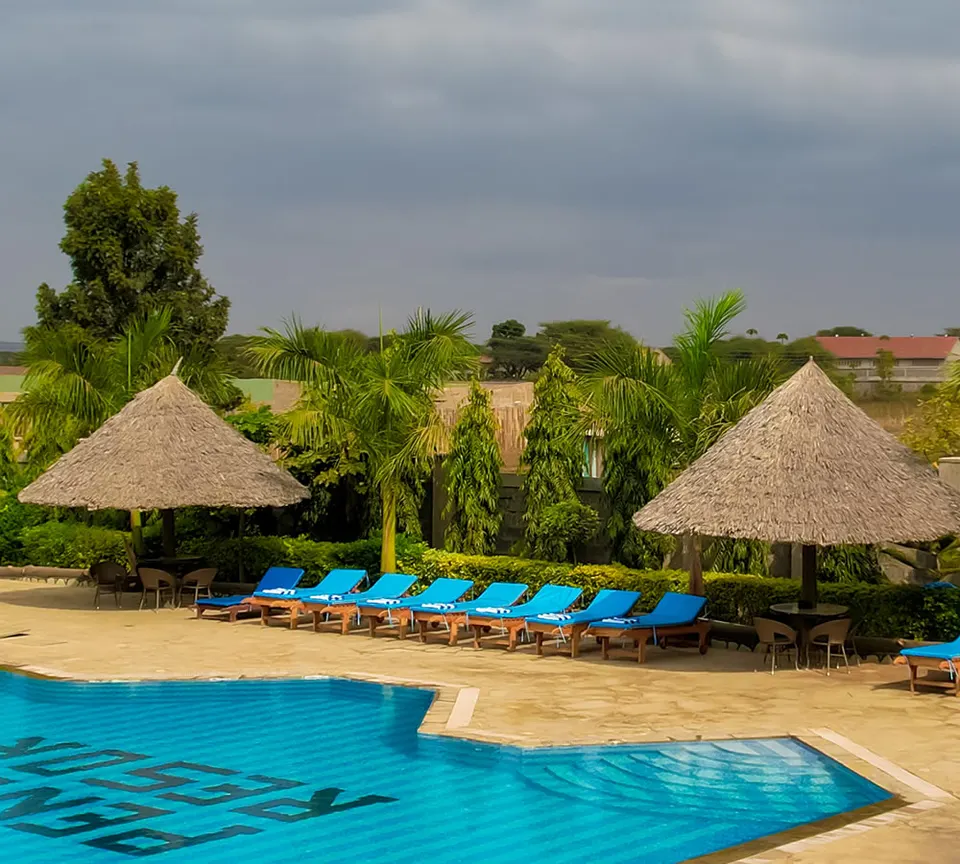 Penety Amboseli Resort swimming pool and thatched seating