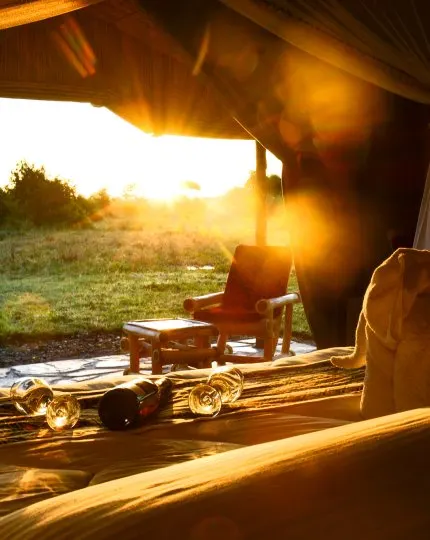 Seating and drinks on a veranda at sunset