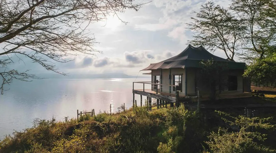 Tented suite exterior and lake outlook