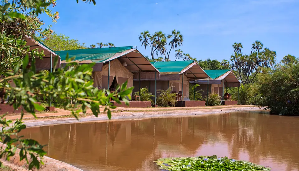 Bora Bora tent exteriors beside the man-made dam