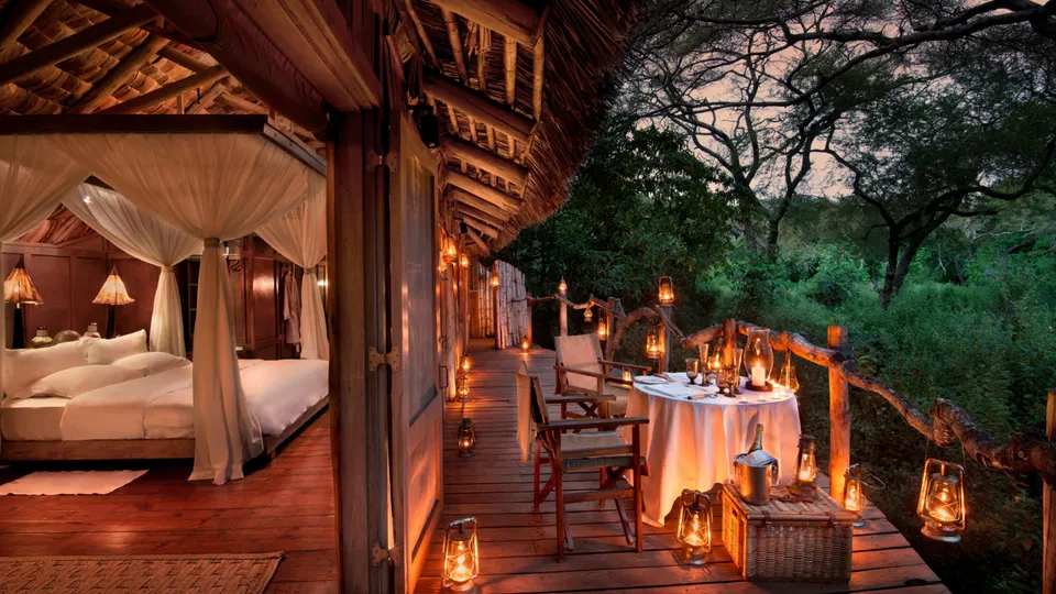 Lake Manyara Tree Lodge suite and veranda at dusk